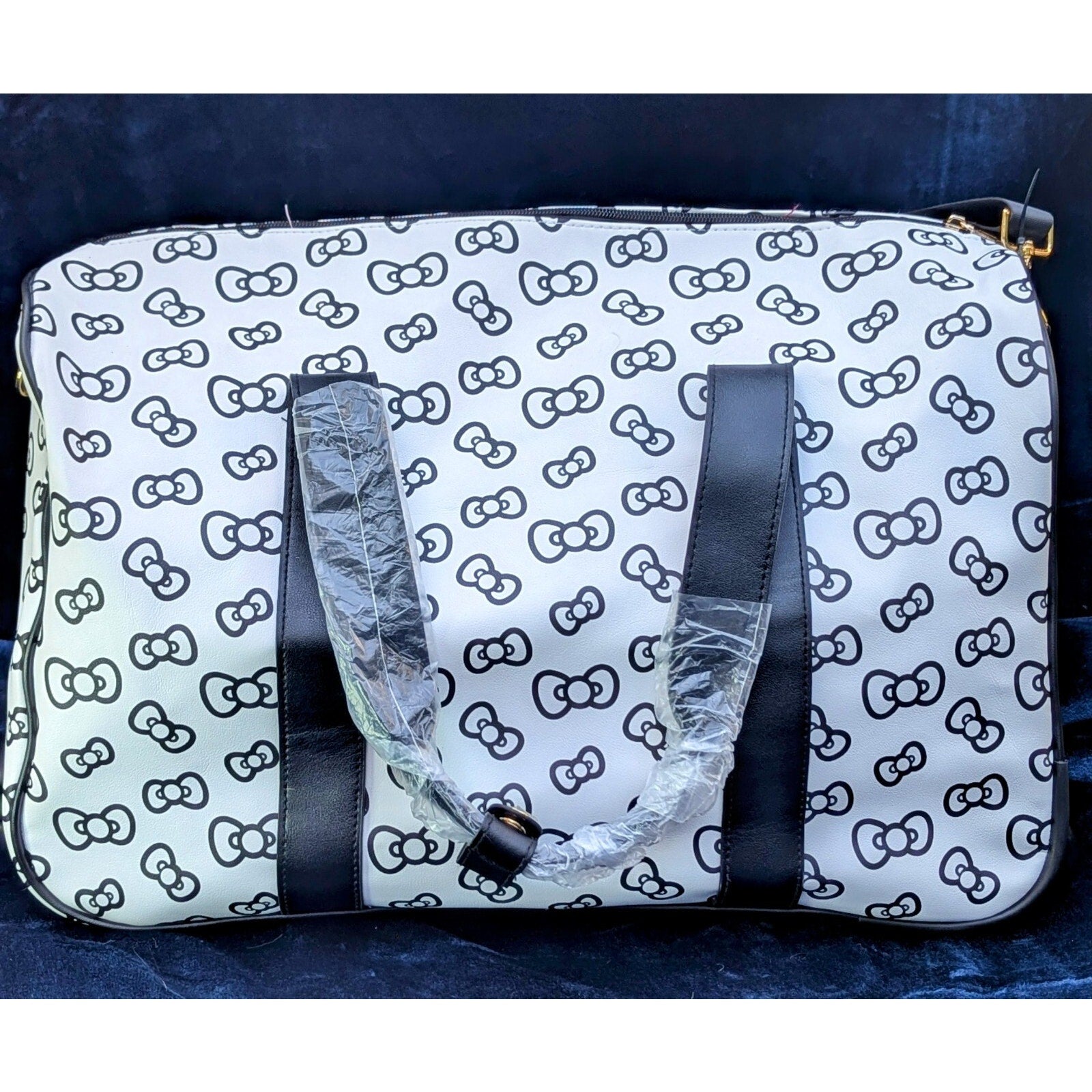 Hello Kitty Carryon Travel/Weekend Bag with Wheels and adjustable handle.